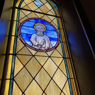 a stained glass window of st joseph