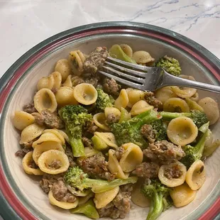 a plate of pasta and broccoli