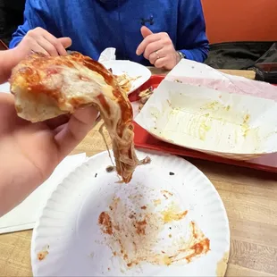 Shows the pizza we love, some bend to it but not soggy.. and the empty Wing boat-- forgot to get a pic because they were Sooooo goooood!!