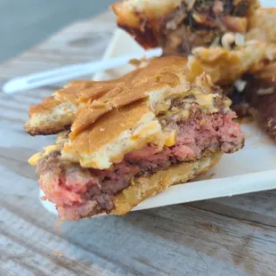 a sandwich with meat and cheese