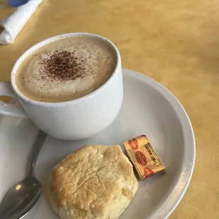 a cup of coffee and a biscuit