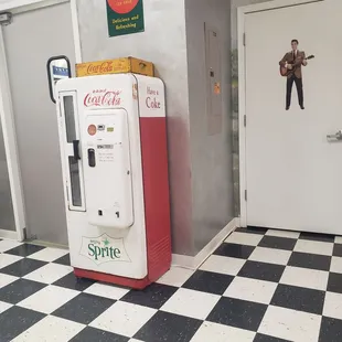 a coke machine and a door