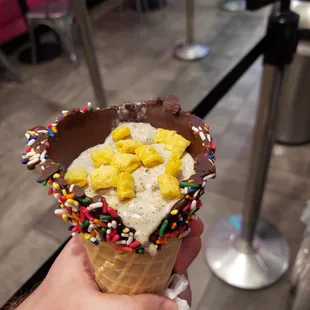 an ice cream cone with sprinkles