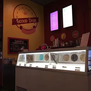 a counter with a variety of ice creams