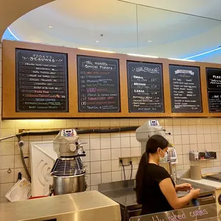 a woman working at a counter