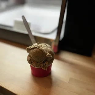 a cup of ice cream on a table
