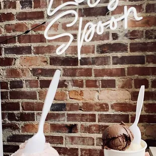 two people holding bowls of ice cream