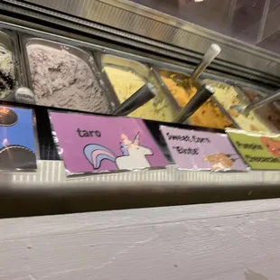 a variety of ice creams in a display case