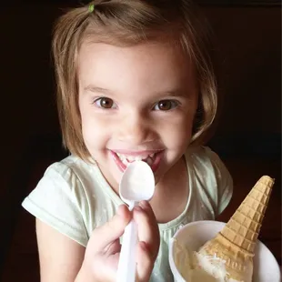 Enjoying Birthday Cake ice cream in a cone/cup.