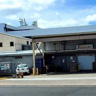 As you drive down Leokane Street, when you see &quot;Redondo&apos;s&quot;, Scoopers Kitchen is just across the street from Redondo&apos;s.
