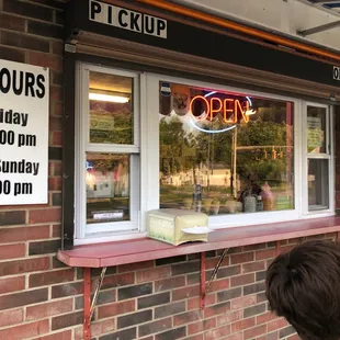 a boy looking in the window