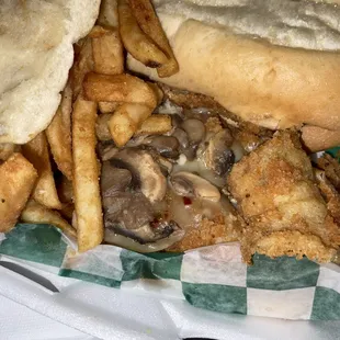 Fish sandwich with mushrooms and cheese