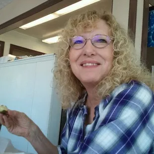 a woman eating a sandwich