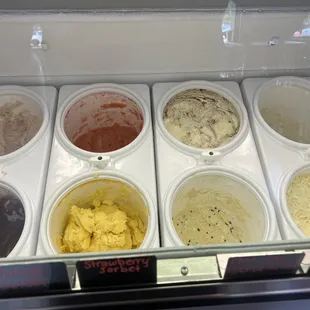 a variety of ice creams in a display case