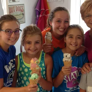 a group of children holding ice cream cones