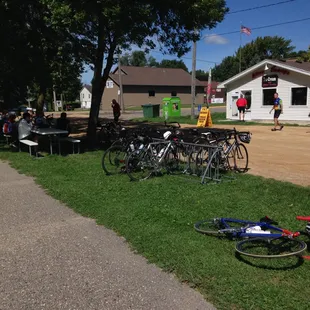 a group of bicycles parked on the side of the road