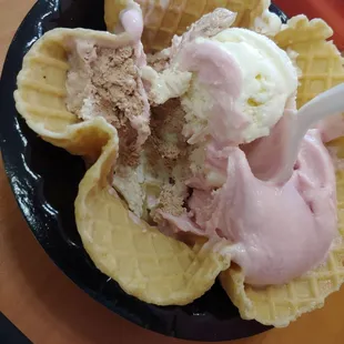 Raspberry sherbet, heath, almond joy, and coconut in a waffle bowl