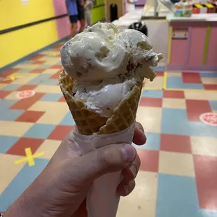 Butter pecan &amp; heath bar on a waffle cone