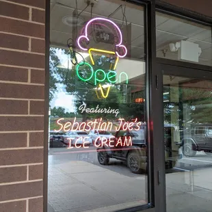 a neon sign in the window