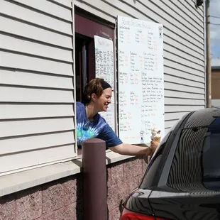 a woman opening a window