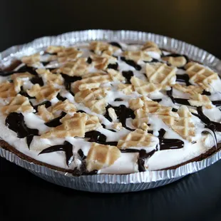 a pie with chocolate and marshmallows