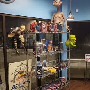 a toy store with a shelf full of toys