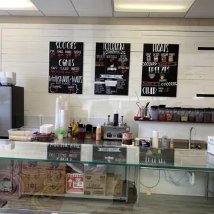 a bakery counter with a variety of pastries