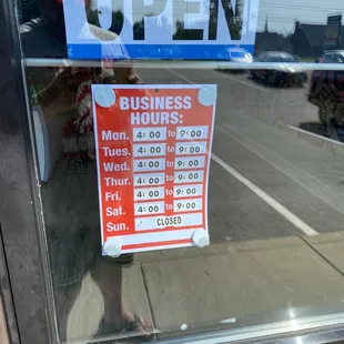 a business hours sign