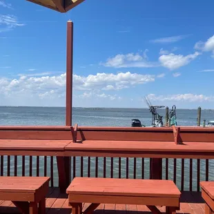 a view of the ocean from a deck