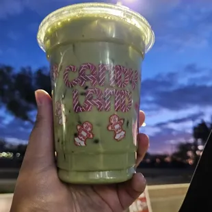 Small matcha iced Latte packed with ice cubes