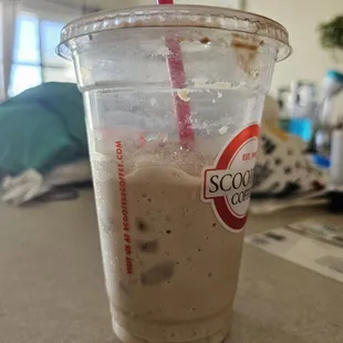 a cold beverage in a plastic cup