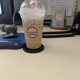 a cup of coffee on a desk