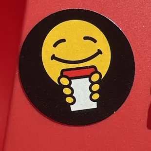a smiley face on a sticker