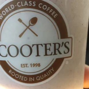 a person holding a cup of coffee