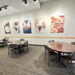 a dining area with tables and chairs