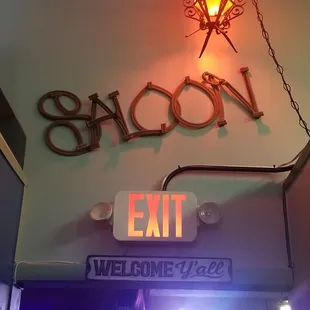 SALOON entrance located near restroom in the very back