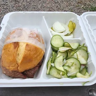 Sliced brisket sandwich, cucumber onion salad