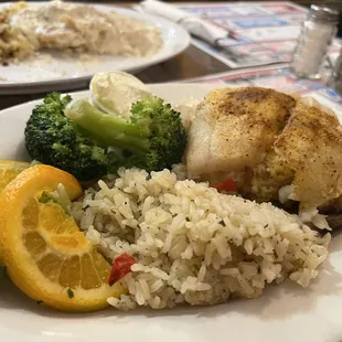 Crab stuffed rockfish with imperial sauce, rice pilaf, and broccoli