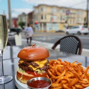 Award-Winning Bergey Burger with Double Patty, Cheese, Risque Sauce, on Brioche with Curly Fries