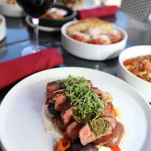 8 oz Ribeye Steak Dinner with whipped feta, fingerling potatoes, Italian peppers, and chimmichuri