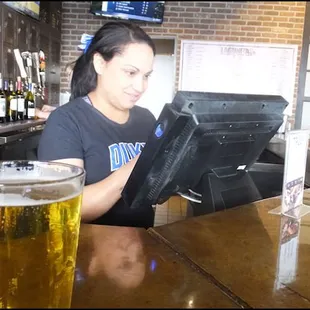 After placing my order for a one-topping medium pizza, I sat at the bar, sipped on a beer, and chatted with my friendly server, Brittney.