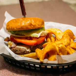 a hamburger and french fries in a basket