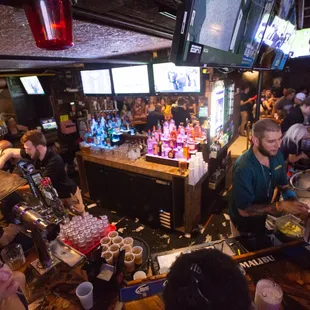 a crowd of people at a bar