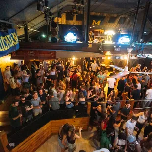a crowd of people in a bar