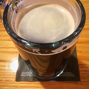 a cup of coffee on a coaster