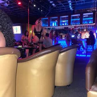 a group of people sitting at a bar