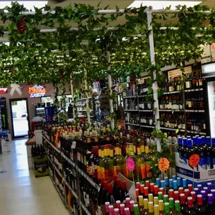 rows of bottles of liquor in a store