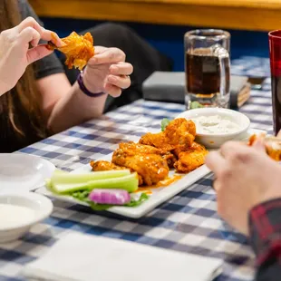a group of people eating at a restaurant