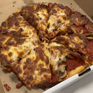 Small pepperoni and mushroom.  A little overcooked and dry.