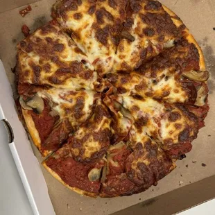 Small pepperoni and mushroom.  A little overcooked and dry.